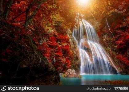 Waterfall in tropical deep forest with autumn color change Beautiful nature, Thailand.. Pha Nam Yod Waterfall.