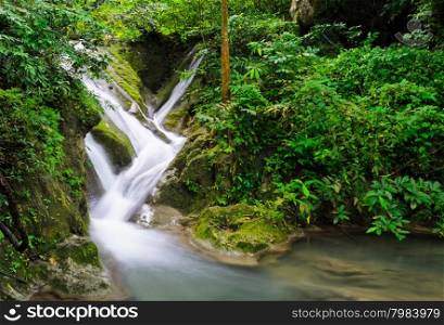 Waterfall in tropical rain forest, Thailand