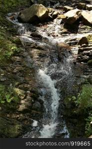 waterfall. mountain waterfall in park
