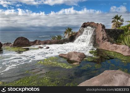 waterfall next to the sea in the Canary Islands, Tenerife
