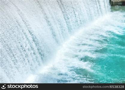 Waterfall on a big dam. Cascade on Segre river in Spain. Waterfall on a big dam