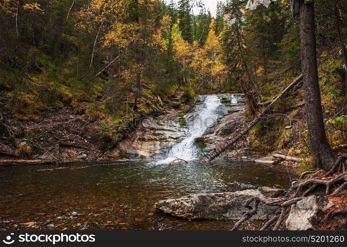waterfall on mountain river. waterfall in the forest on mountain river