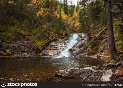 waterfall on mountain river. waterfall in the forest on mountain river