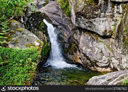 Waterfall on the river Zhigalan on a ridge Kvarkush in the north of the Ural mountains