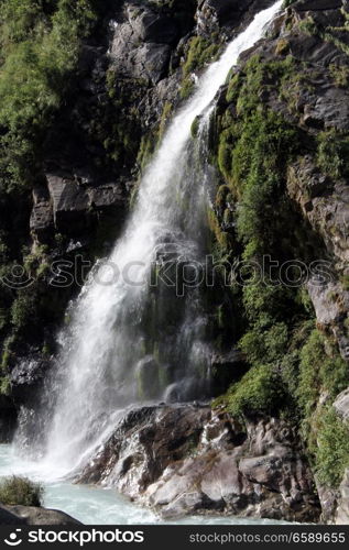 Waterfall on the rock and mountain river in NEpal