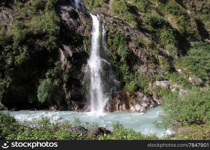 Waterfall on the rock and river in mountain, Nepal