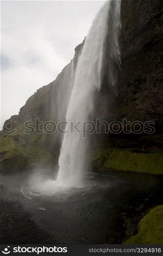 Waterfall over a cliff in Iceland