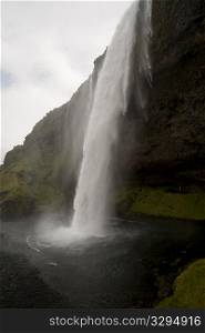 Waterfall over a cliff in Iceland