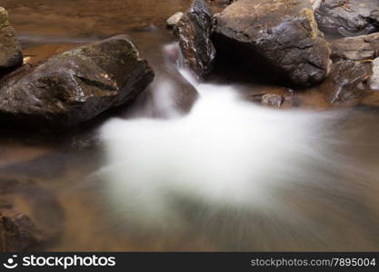 Waterfall that flows down from the mountains. Streams of water flowing down from the mountains. There is always a small stone waterfall.