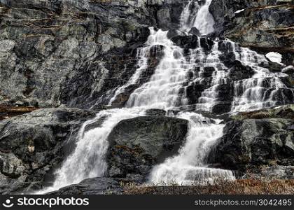 Waterfalll at NufsgrA?van in the mountain massif of Jotunheimen. Waterfalll at NufsgrA?van