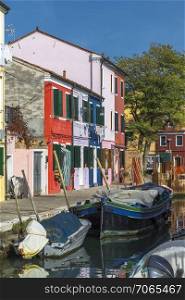 Waterfront canal on the island of Burano. Italy