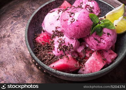 Watermelon fruit ice cream. Watermelon ice cream with grated chocolate and lime