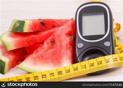 Watermelon, glucose meter for measuring sugar level and tape measure, concept of diabetes, healthy lifestyles, nutrition and slimming. Watermelon, glucometer for measuring sugar level and tape measure, diabetes, healthy lifestyles and slimming concept