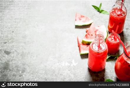 Watermelon juice with mint . On the stone table.. Watermelon juice with mint .