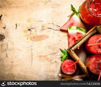 Watermelon juice with pulp. On wooden background.. Watermelon juice with pulp.