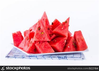 Watermelon red flesh cut into pieces on a white background.