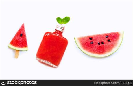 Watermelon slice and popsicle with bottle of healthy watermelon juice isolated on white background.
