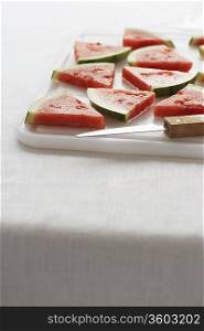Watermelon slices on chopping board, close-up
