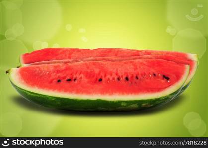 Watermelon slices on green fresh summer background