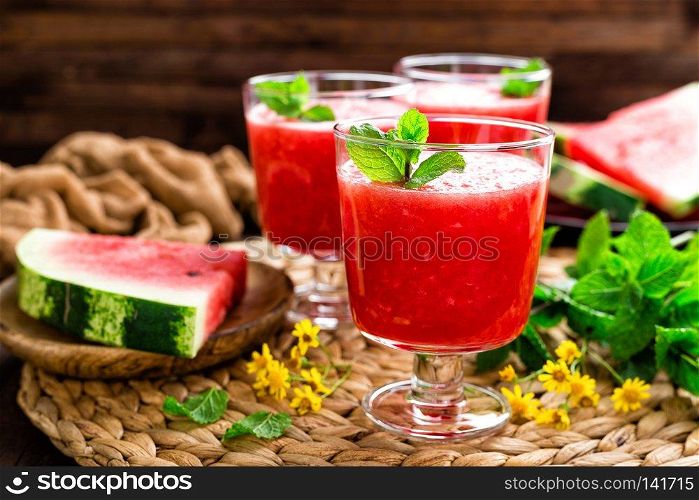 Watermelon smoothie. Watermelon drink, cocktail on wooden rustic background