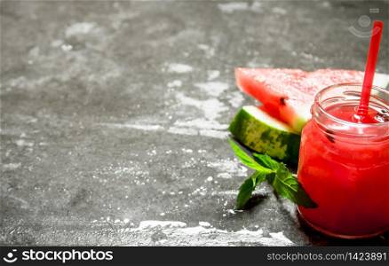 Watermelon smoothie with mint. On the stone table.. Watermelon smoothie with mint.