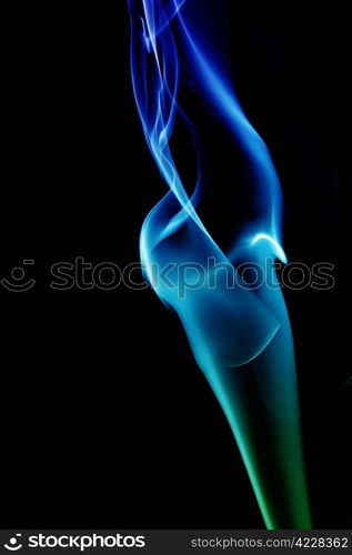 wave and smoke of different colors on black background