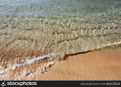 Wave of sea on sandy beach. Soft wave of the sea on the sandy beach