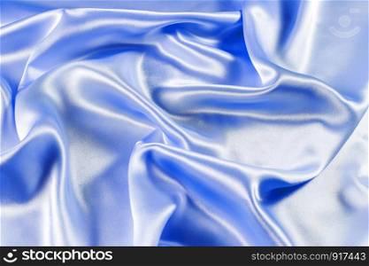 Wave on shiny blue fabric.
