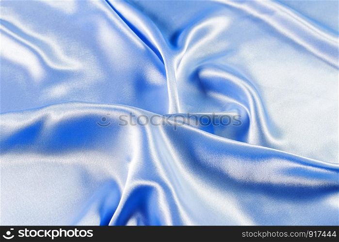 Wave on shiny blue fabric.