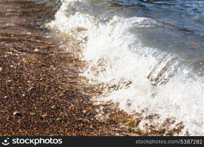 Wave on the Adriatic sea, pebble shore