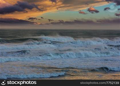 Wave on the beach at sunset, New Zealand coast