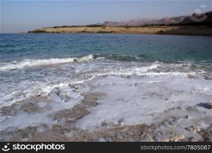 Wave on the Dead sea on the coast, Jordan