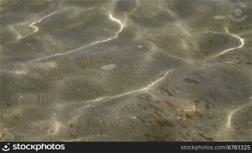 Wave pattern with sand underwater