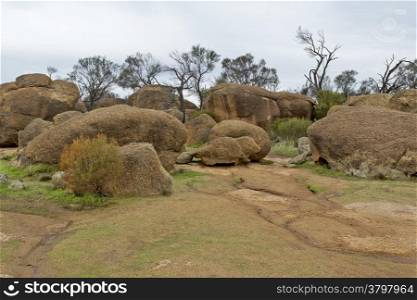 Wave Rock, granite boulders laying on top of the Wave Rock monolith near Hyden in Western Australia