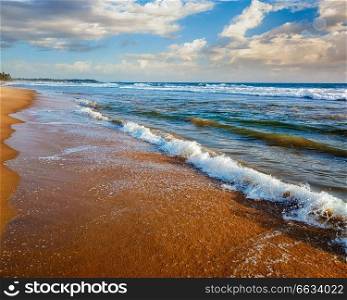 Wave surging on sand on beach. Wave surging on sand