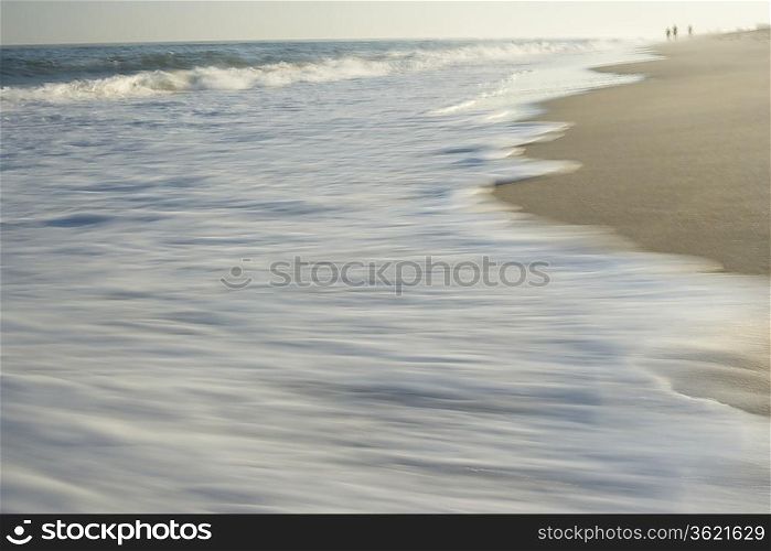 Wave washing on shore blurred motion