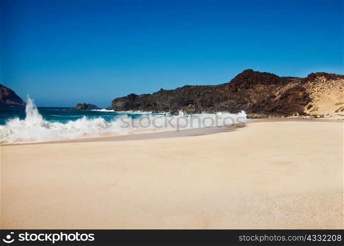 Waves against shore of beach, La Gracioca, Lanzarote, Spain