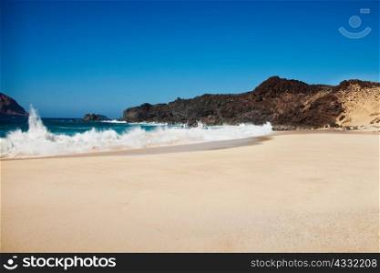 Waves against shore of beach, La Gracioca, Lanzarote, Spain