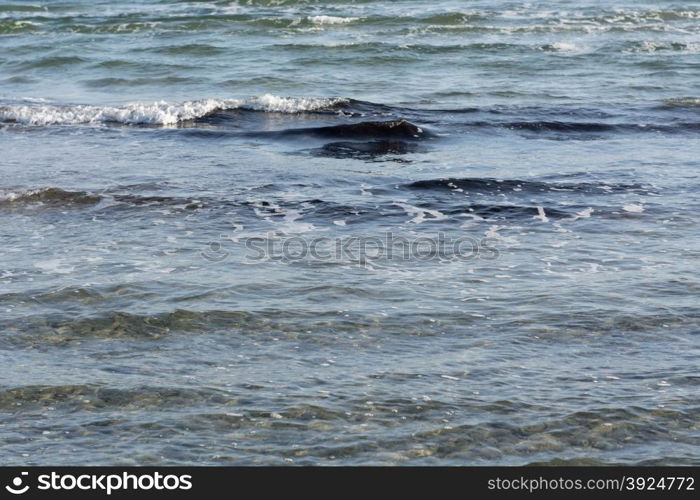 Waves at beach. Small waves and shallow water pattern on a beach