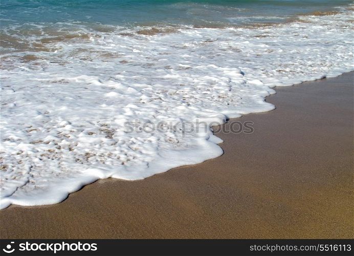 Waves breaking on shore of the sea