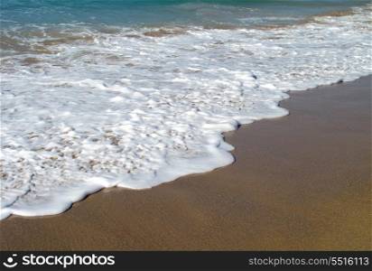 Waves breaking on shore of the sea