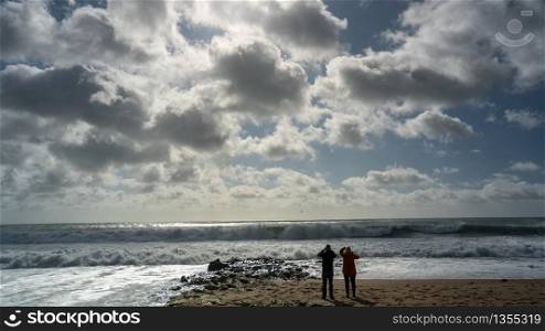 Waves crash on to the rocks and beaches of a cornish coastline, UK