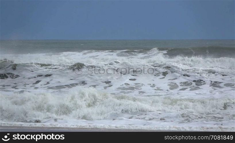 Waves crash on to the shore