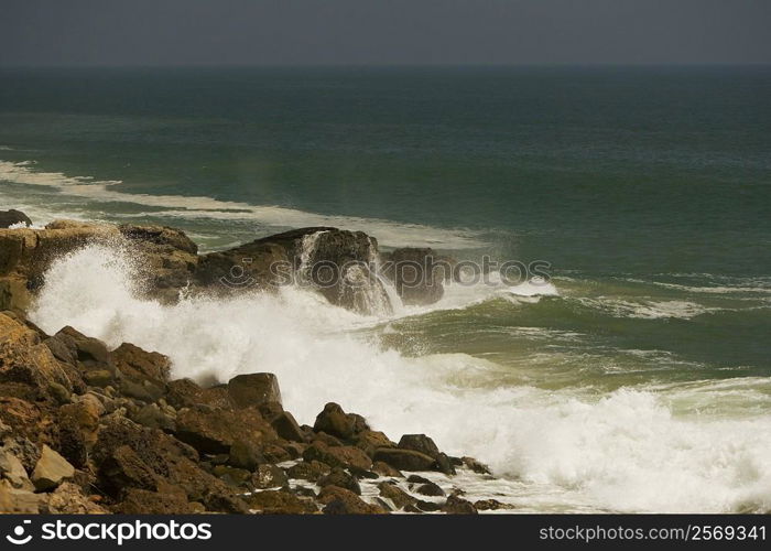 Waves crashing against rocks in the sea