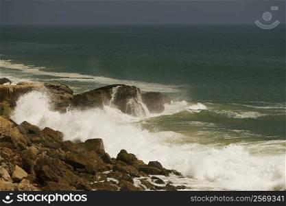 Waves crashing against rocks in the sea