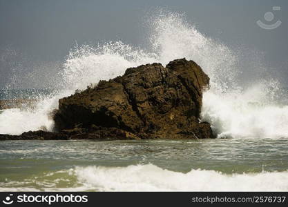 Waves crashing against rocks in the sea