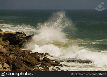 Waves crashing against rocks in the sea