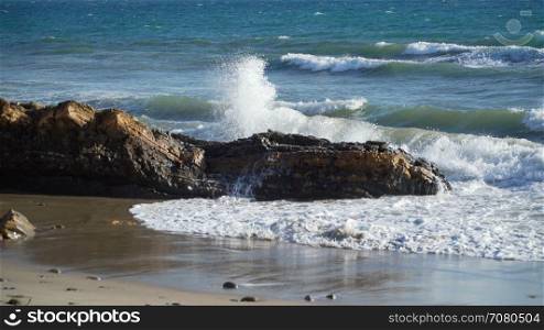 Waves hitting rocks on beach near Point Conception State Marine Reserve
