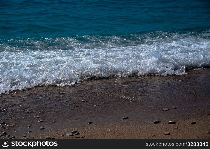 Waves hitting the beach at Oludeniz, near Fethiye, Turkey