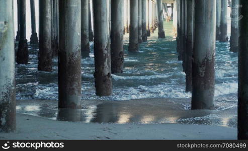 Waves hitting the pilings under the Santa Monica Pier.